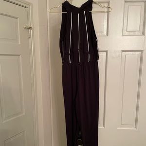 Black (and white) jumpsuit one piece. Size 4
